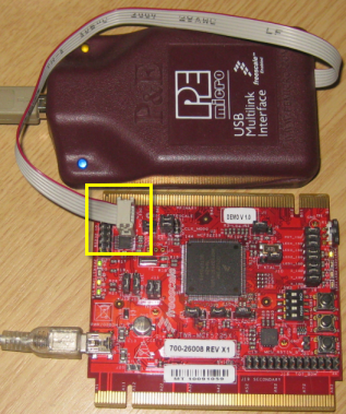 My old Rev X1 board with BDM header populated and P&E Multilink attached