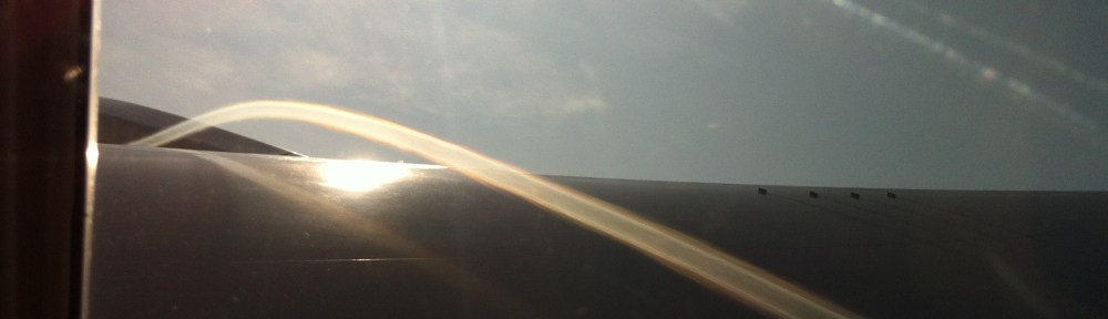 Vapour Trail above Wing